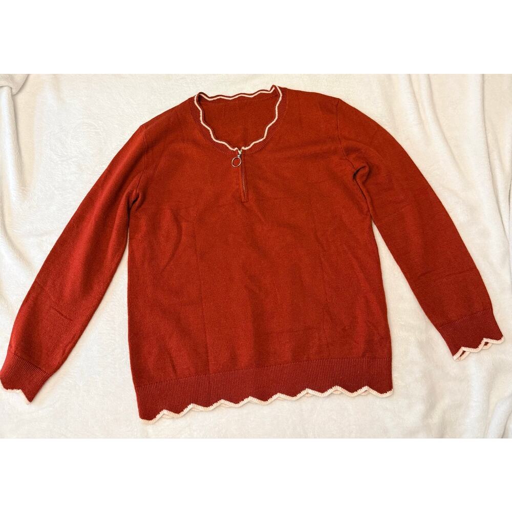 burnt orange quarter-zip pullover sweater with white-trimmed scalloped neckline